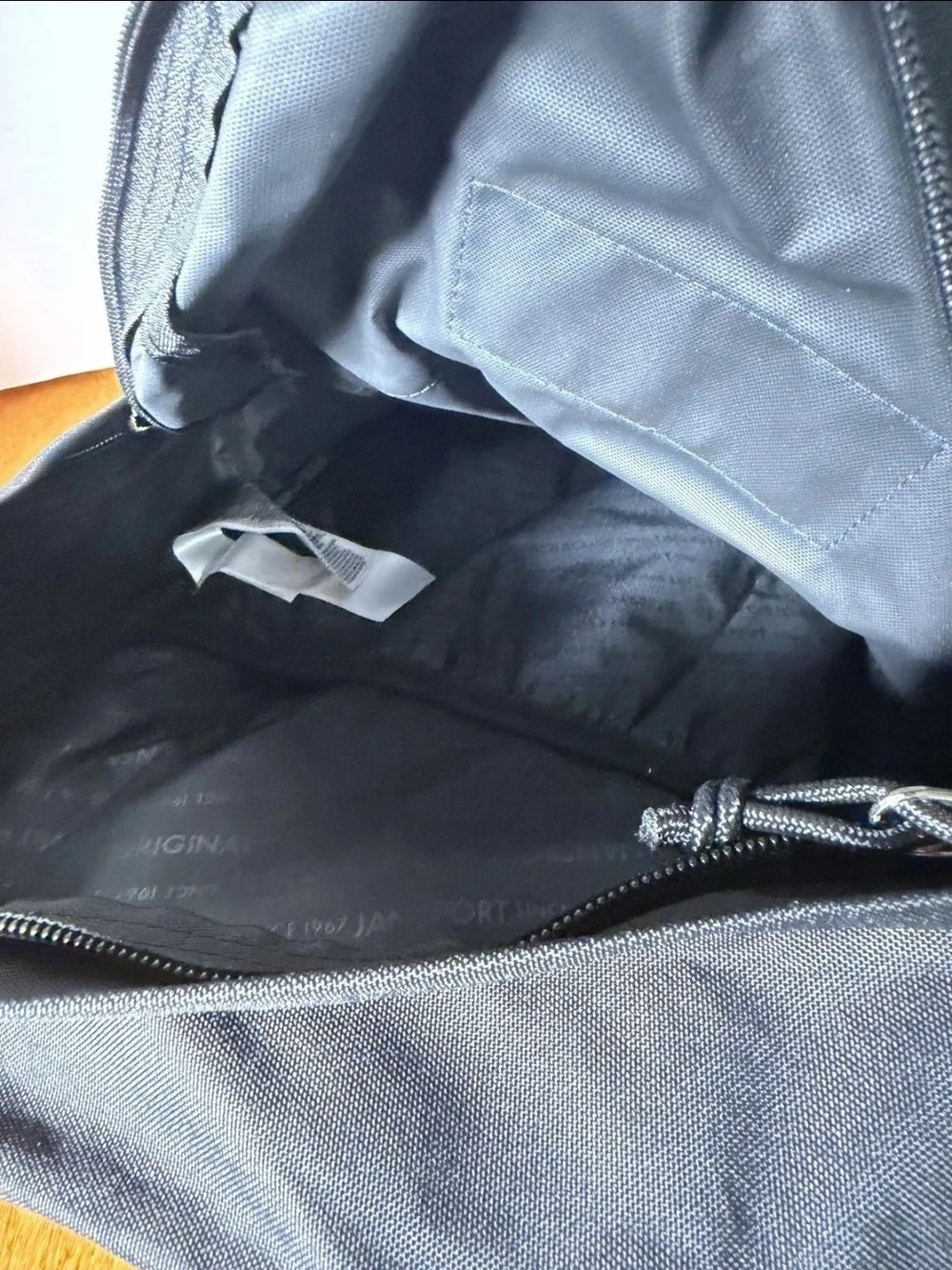 Jansport Black Backpack with Navy Patch and Red Logo